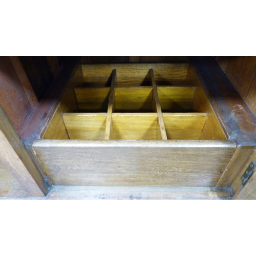 337 - Edwardian oak sideboard with cellarette drawer and assorted drawers and cupboards.