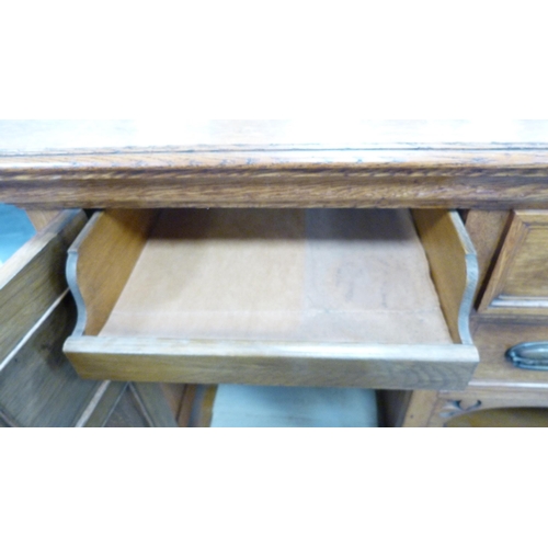 337 - Edwardian oak sideboard with cellarette drawer and assorted drawers and cupboards.