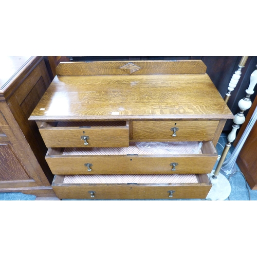 338 - 1930s/40s oak chest of two short and two long drawers.