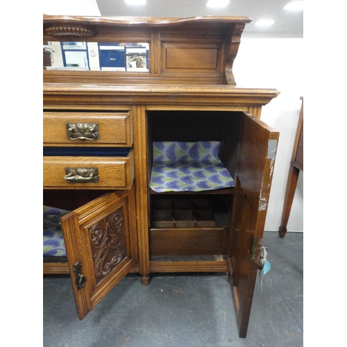 344 - Edwardian oak mirror-back sideboard with brass handles, assorted drawers and cupboards.