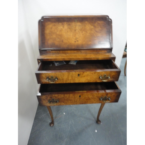 345 - Lady's figured walnut writing bureau on cabriole supports.