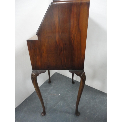 345 - Lady's figured walnut writing bureau on cabriole supports.