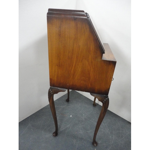 345 - Lady's figured walnut writing bureau on cabriole supports.