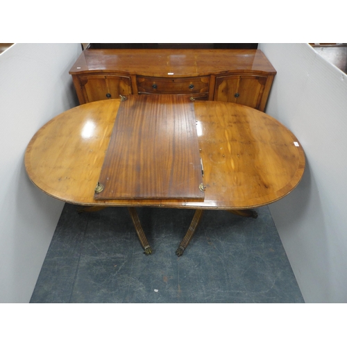 346 - Modern yew wood dining table with additional leaf and a modern yew wood serpentine sideboard.  (2)