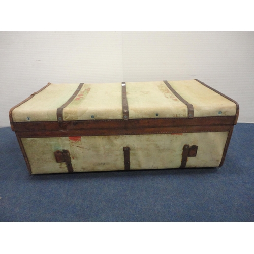 364 - Canvas and metal-bound travel trunk.