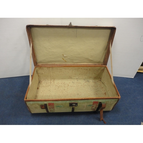 364 - Canvas and metal-bound travel trunk.