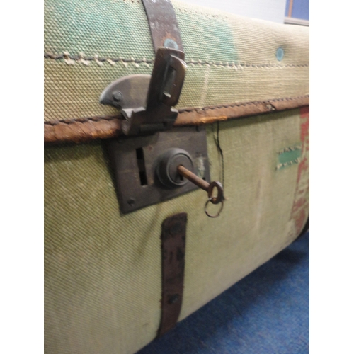 364 - Canvas and metal-bound travel trunk.