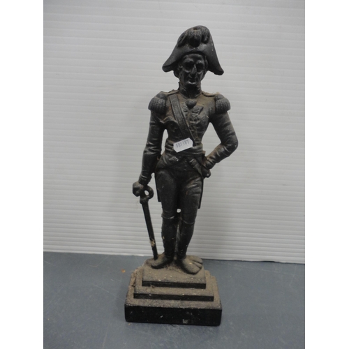 53 - Iron doorstop modelled as Nelson, brass coal helmet, brass pot, table lamp and a copper kettle.