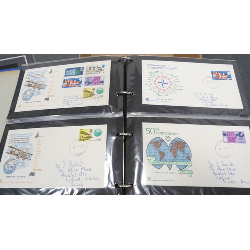 64 - Six assorted folders containing first day covers and postcard albums.