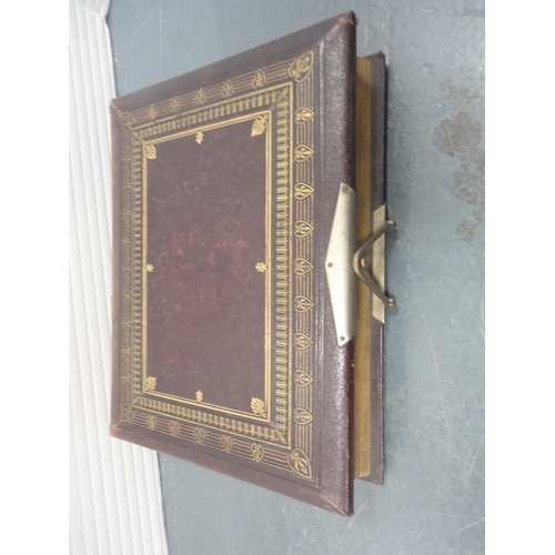 79 - Two Edwardian tooled photograph albums and contents.