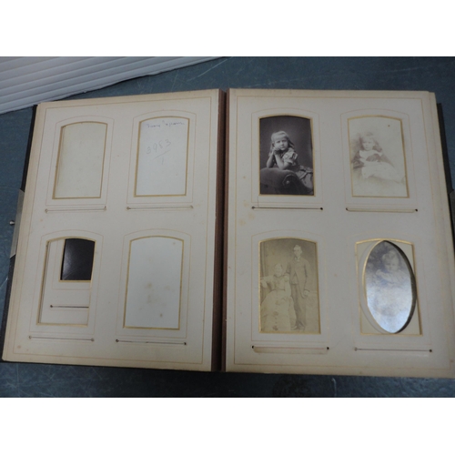 79 - Two Edwardian tooled photograph albums and contents.