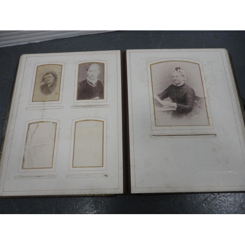 79 - Two Edwardian tooled photograph albums and contents.