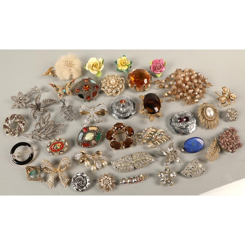 133 - Large assortment of vintage brooches including micromosaic, grouse foot, duette, etc.