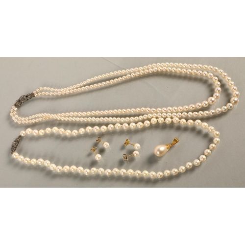 144C - Two pearl necklaces with marcasite set clasps, two pairs of pearl earrings on 9ct gold backs, and a ... 