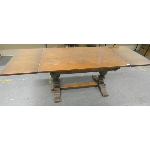 579 - Large oak draw leaf Priory style dining table.