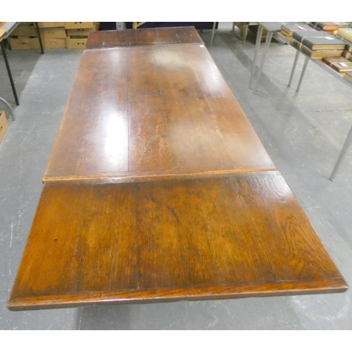 579 - Large oak draw leaf Priory style dining table.