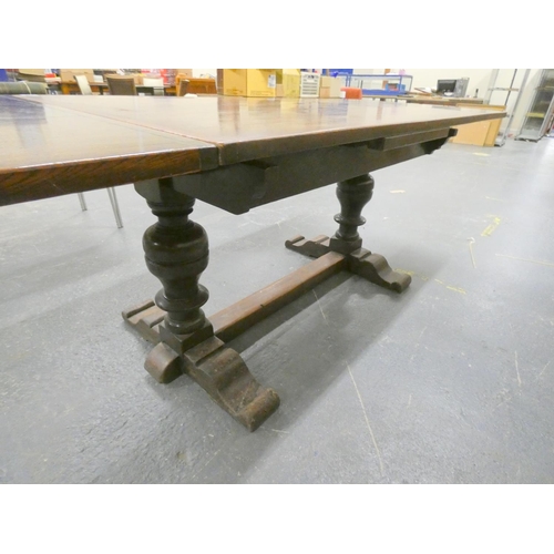 579 - Large oak draw leaf Priory style dining table.