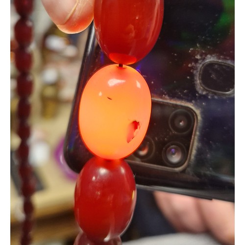 83 - Cherry amber / bakelite beaded necklace, 54g gross weight