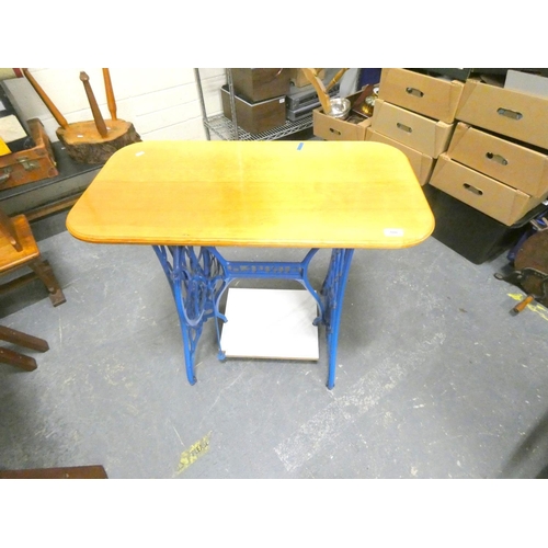 186 - Cast iron sewing machine table. 