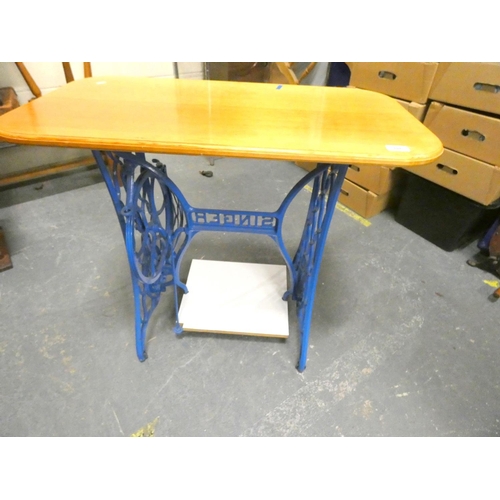 186 - Cast iron sewing machine table. 