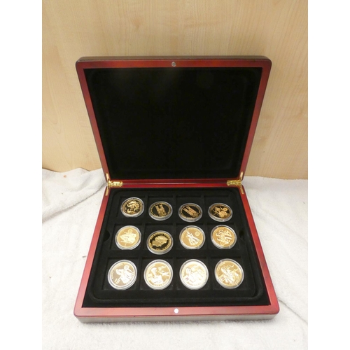 521 - Cased set of 24 gold plated commemorative crowns dated 2012 and relating to the Diamond Jubilee. Iss... 