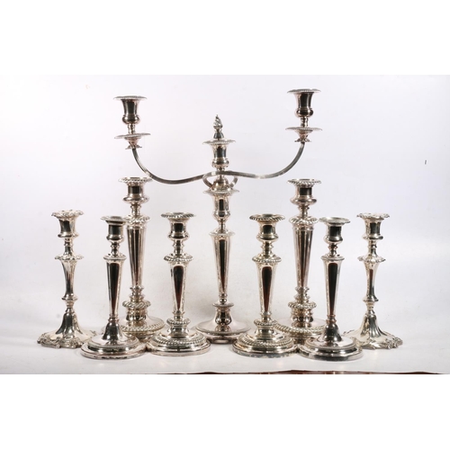 1 - Silver plated twin branch candleabra, with four pairs of silver plated candlesticks.