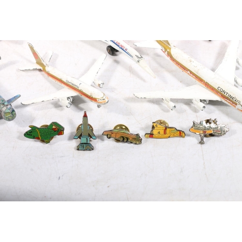 283A - Selection of die cast painted plane toys and Thunderbirds enamel badges