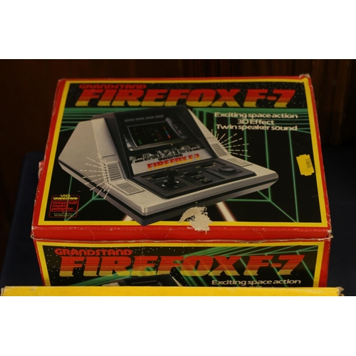 32 - Group of Retro gaming consoles and accessories to include boxed Firefox F-7 by Grandstand, boxed Aja... 