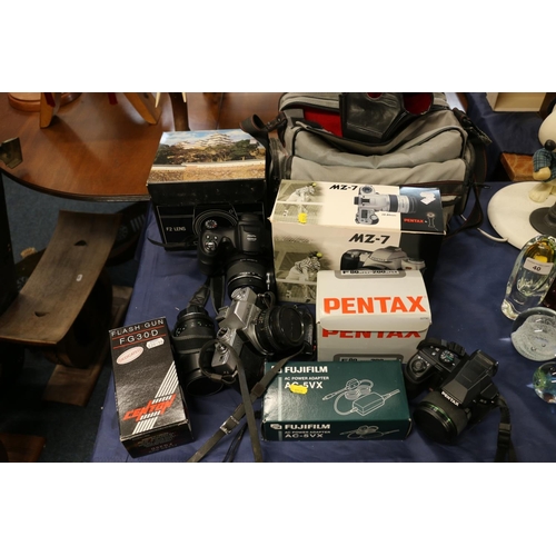 37 - Collection of cameras to include Minolta SR T 100, Pentax X-5, Fujifilm Finepix, boxed Pentax MZ-7, ... 