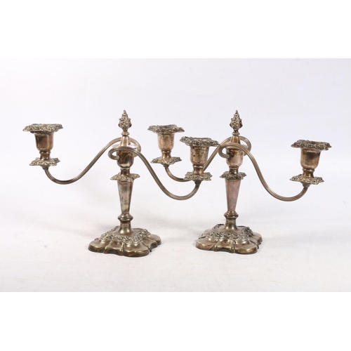 69 - Pair of silver plated twin branch candelabrum.