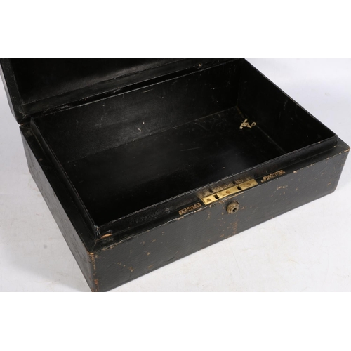 8 - Victorian tooled leather deed box with brass handle, Bearing gilded crown cypher and monogram to the... 