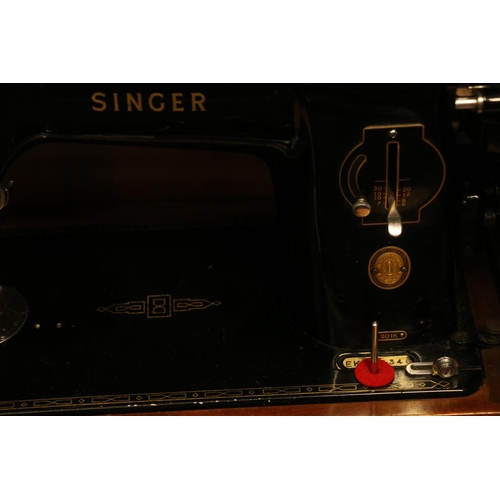 303 - Cased Singer sewing machine.