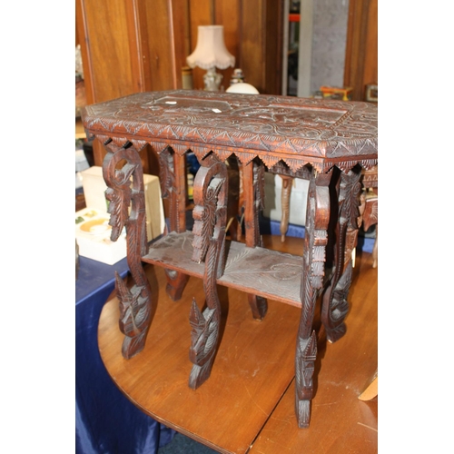 693 - Burmese carved occasional table, 64cm tall.