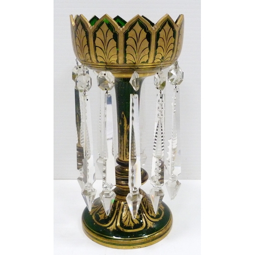 258 - Victorian green glass table lustre of large form decorated all over with gilded leaf vignettes and f... 