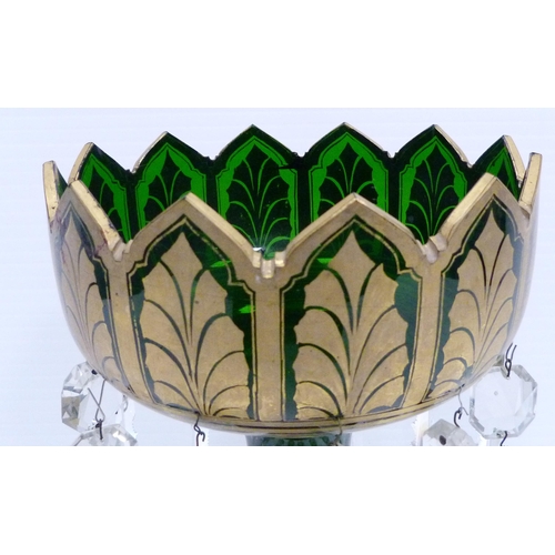 258 - Victorian green glass table lustre of large form decorated all over with gilded leaf vignettes and f... 