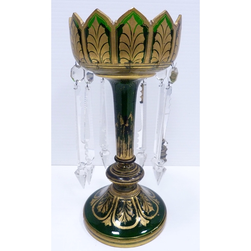 258 - Victorian green glass table lustre of large form decorated all over with gilded leaf vignettes and f... 