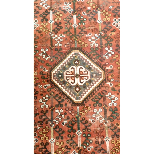 385 - Persian Shiraz hand-knotted rug decorated all over with geometric medallions, motifs and guls on a b... 