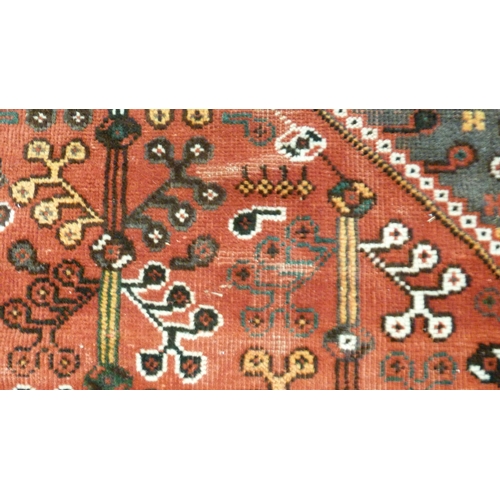 385 - Persian Shiraz hand-knotted rug decorated all over with geometric medallions, motifs and guls on a b... 