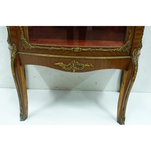 414 - Louis XV style vitrine cabinet with glazed door and side panels enclosing red velour-lined shelving,... 