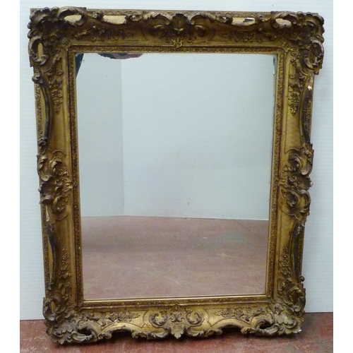 398 - Victorian giltwood and gesso wall mirror, originally a picture frame, with later plate mirror insert... 