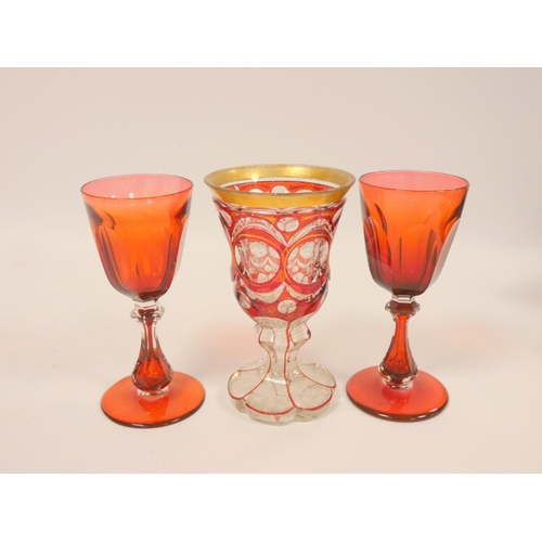 219 - 19th century Bohemian faceted ruby overlay goblet with gilt rim, etched foliate decoration to the cl... 