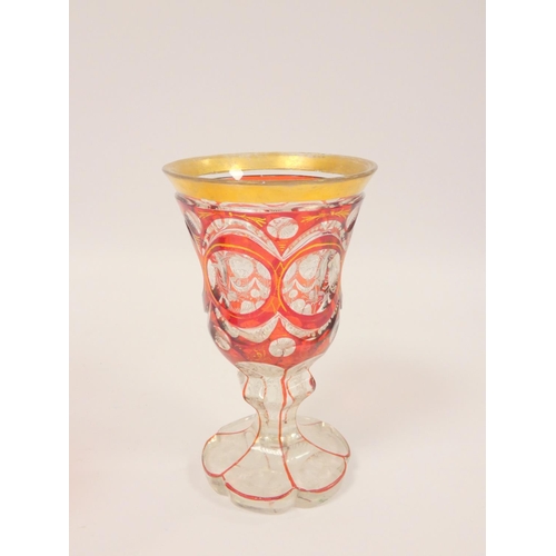 219 - 19th century Bohemian faceted ruby overlay goblet with gilt rim, etched foliate decoration to the cl... 