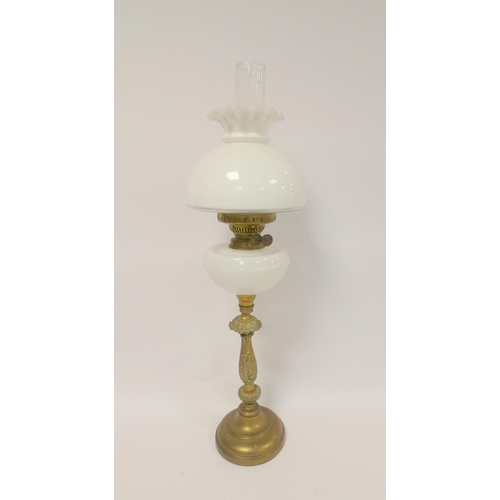 327 - Antique brass duplex oil lamp, stamped to the wick, with opaque glass reservoir and shade, with late... 