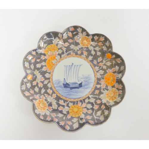 233 - Japanese Fukugawa plate (Meiji 1868-1912) Scalloped edge with allover imari foliage, the well depict... 