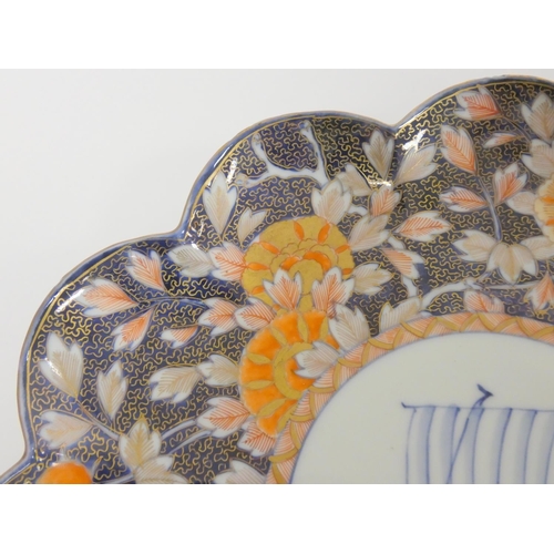 233 - Japanese Fukugawa plate (Meiji 1868-1912) Scalloped edge with allover imari foliage, the well depict... 