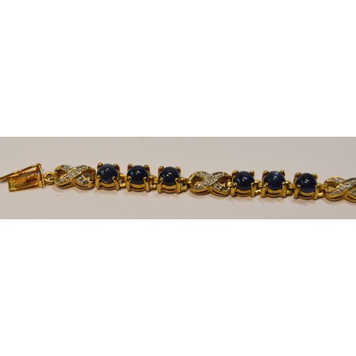 92 - Cabochon sapphire and diamond bracelet, in 9ct gold, 21cm long, 11.5g gross.