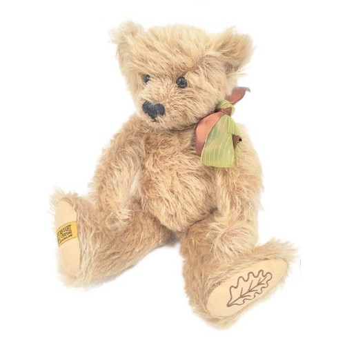 Vintage Merrythought teddy bear with jointed limbs.