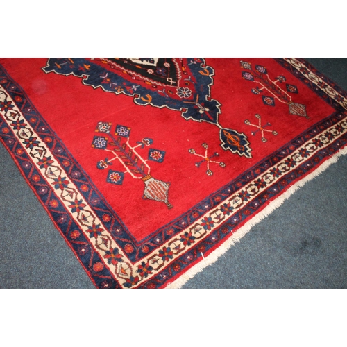 720 - Persian Sirjan rug, 214cm x 163cm.