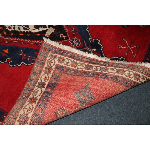 720 - Persian Sirjan rug, 214cm x 163cm.