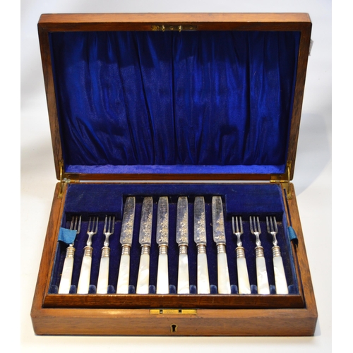 9 - Set of EP fruit knives and forks for twelve, with mother of pearl handles and silver ferrules, cased... 